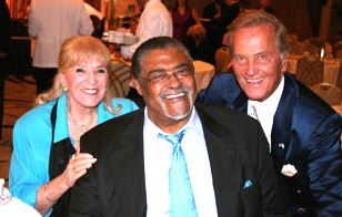 Rosey Grier pictured with Shirley and Pat Boone after Rosey had spoken at the event