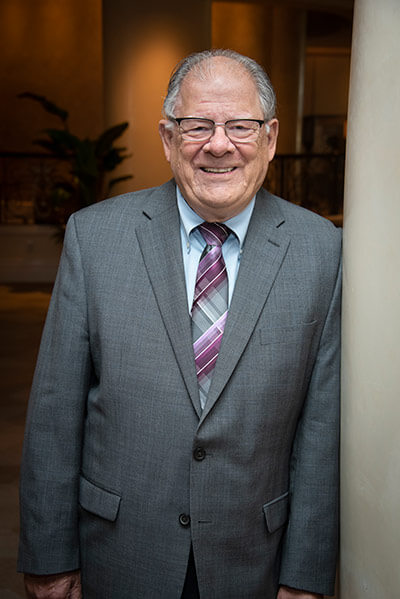 Photo of Pastor Bob Rieth in a gray suite